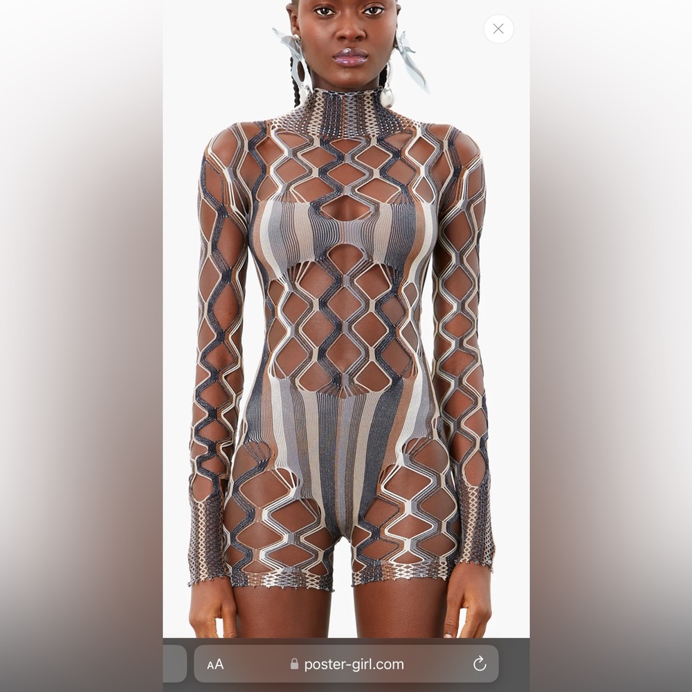 Poster girl romper. One size. Worn once and dry cleaned. Very stretchy.